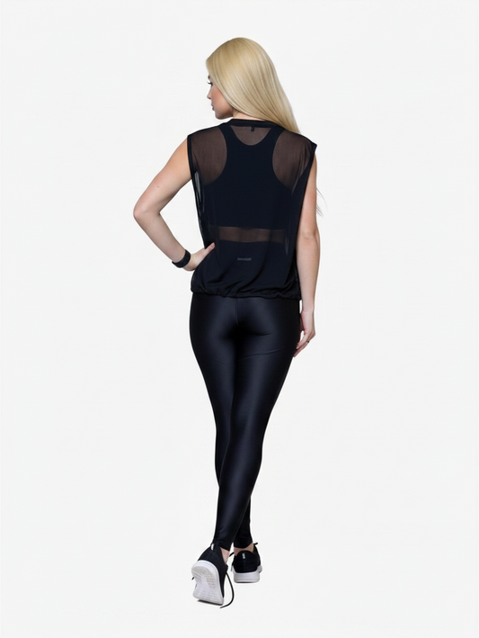 Blonde woman wearing a black JM Brazilian Activewear Dark Flow Vest with breathable mesh back over leggings