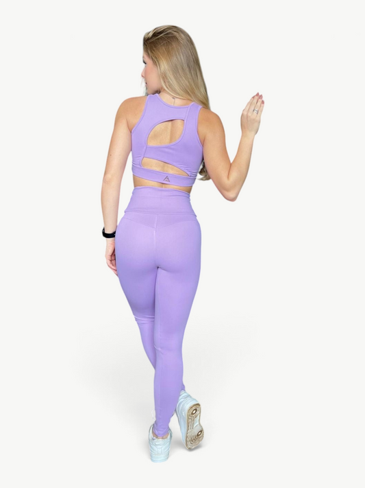 Model wearing JM Brazilian Activewear lavender Soul Legging Set with high-waisted leggings and cutout racerback top