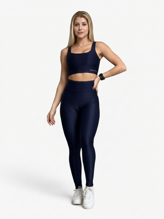 Model wearing a navy blue JM Brazilian Activewear square neck crop top and high-waisted leggings set.