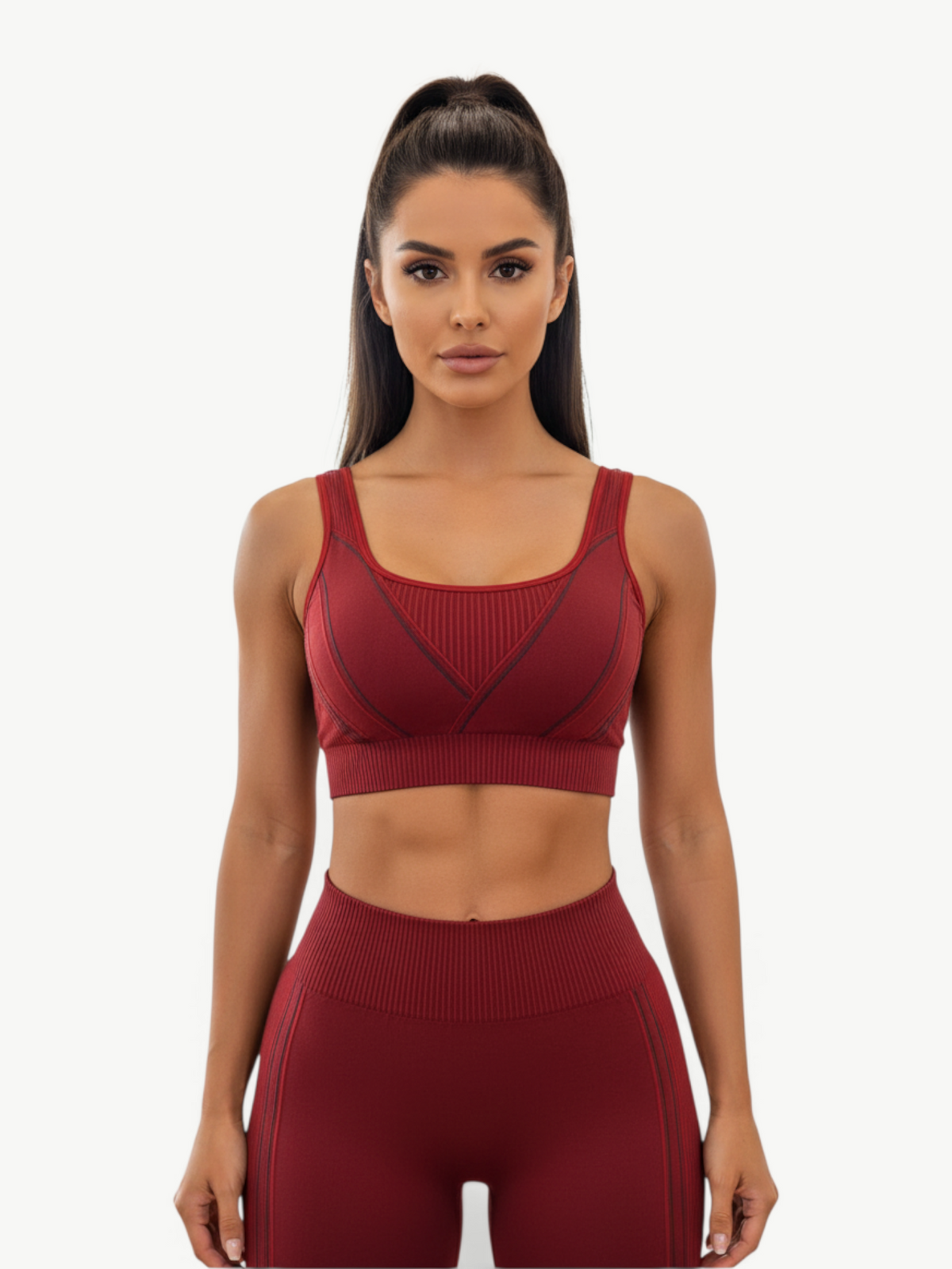 Model wearing JM Brazilian Activewear dark red sculpting sports bra and high-waisted leggings matching set