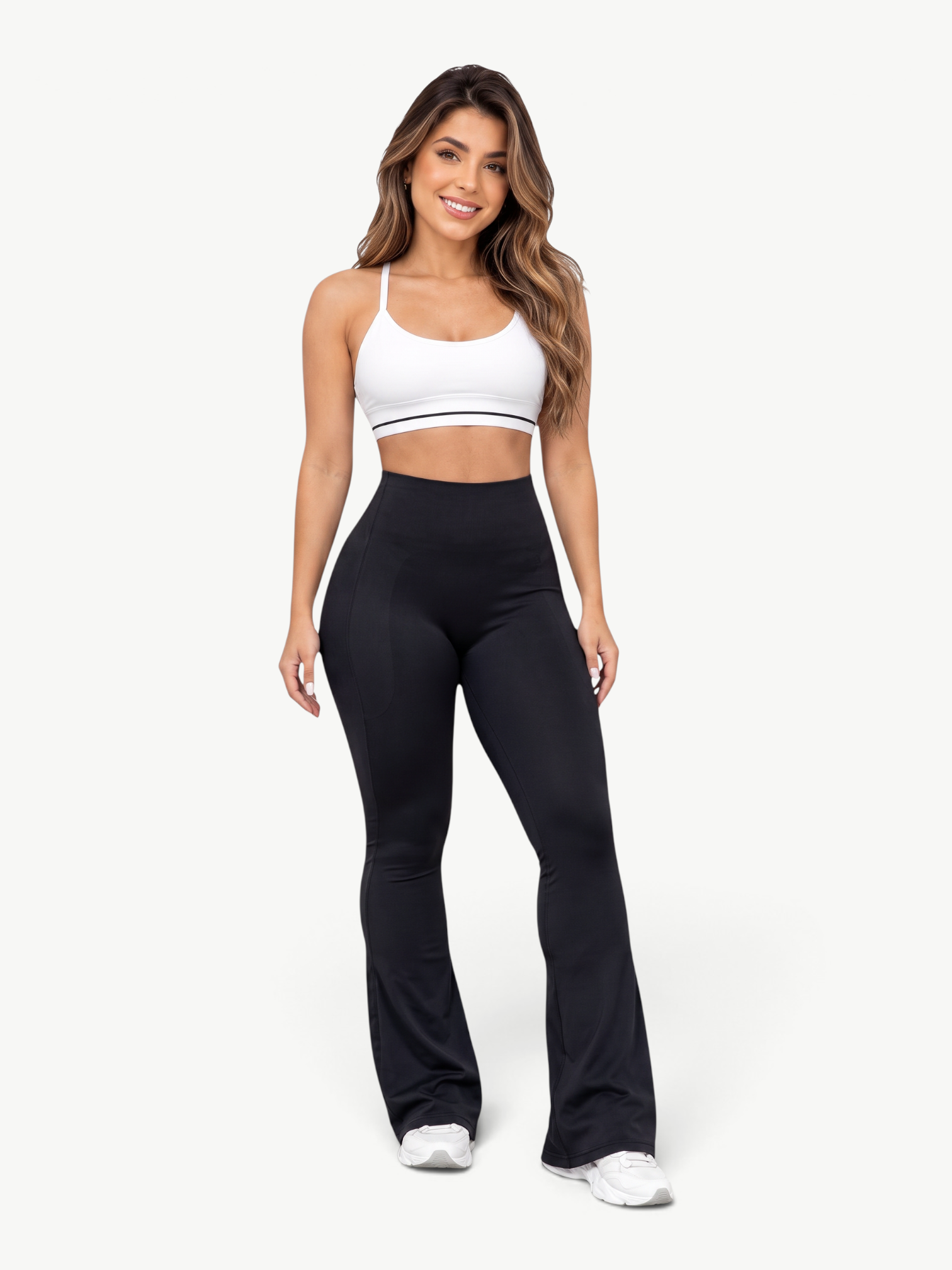 Model wearing JM Brazilian Activewear black high-waisted flare leggings with sculpting seams and supportive fit.