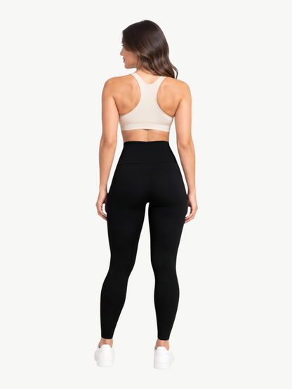 Model wearing JM Brazilian Activewear black high-rise sculpting leggings from the back view
