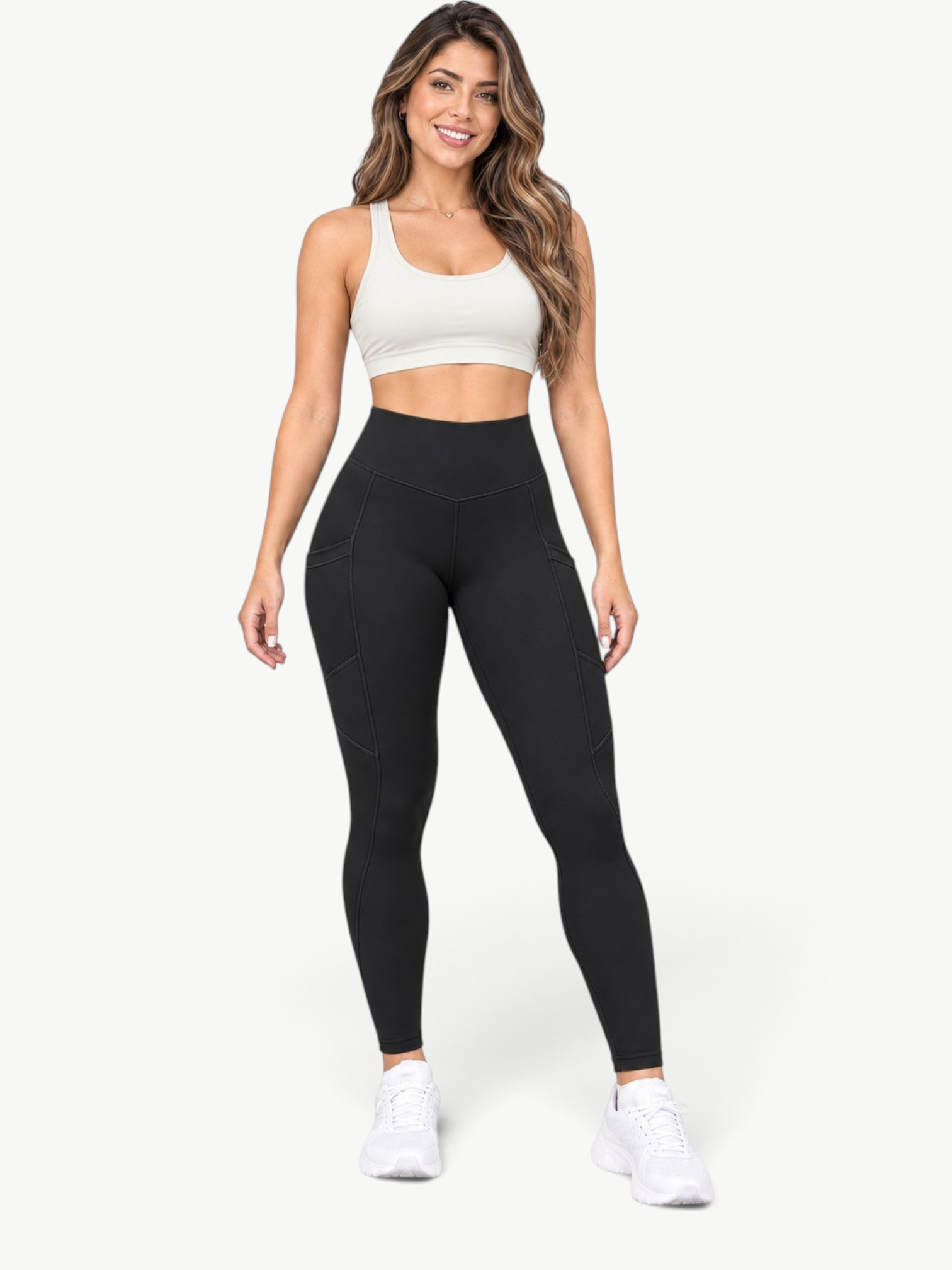 Model wearing JM Brazilian Activewear black high-rise leggings with side pockets and smooth, bleach-resistant fabric.