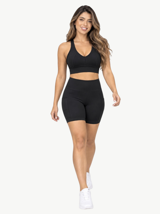 Model wearing a black JM Brazilian Activewear contour pocket biker short set with a matching sports bra.