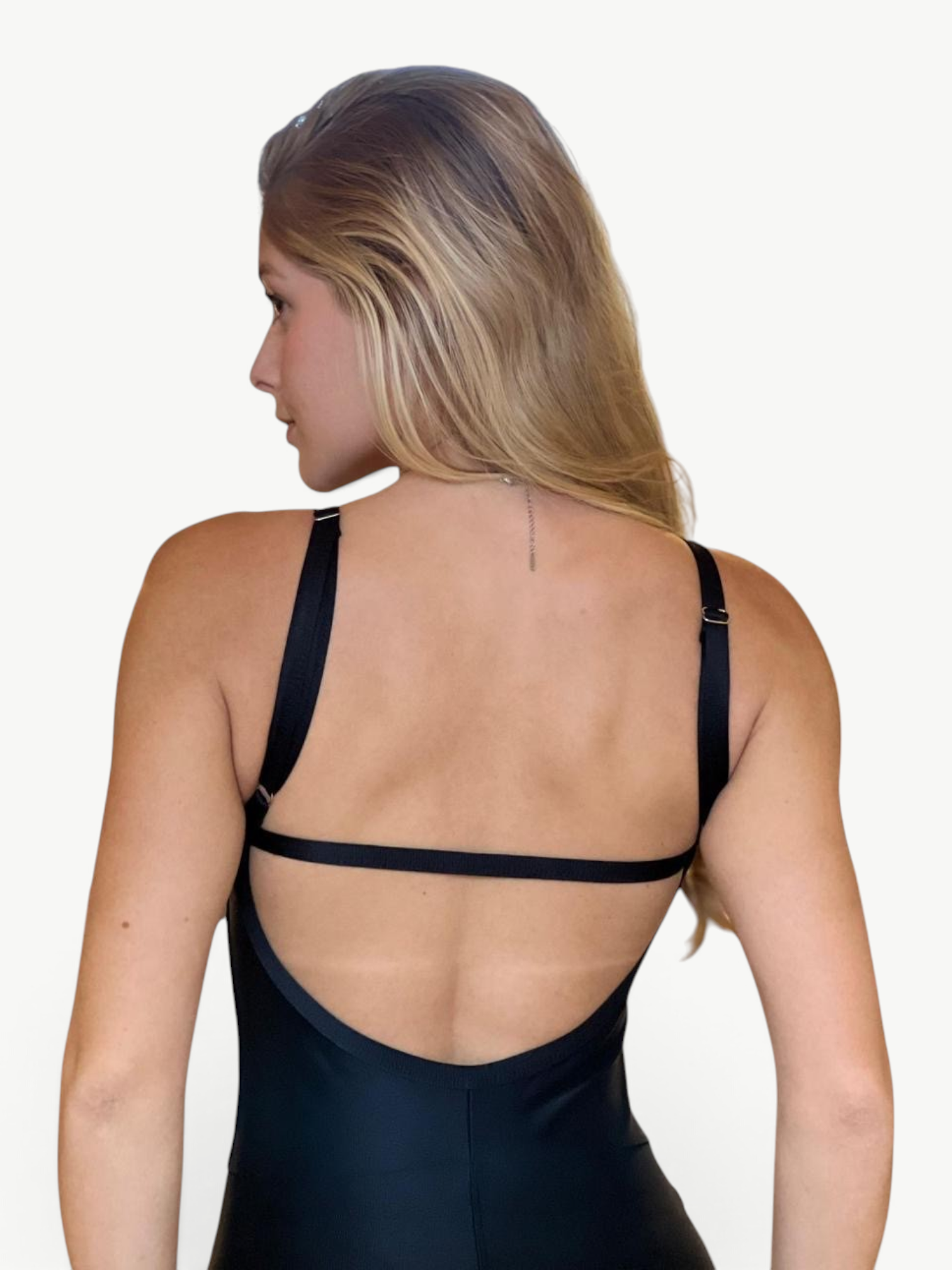 Back view of a woman wearing a black JM Brazilian Activewear Flare Jumpsuit with thin adjustable shoulder straps