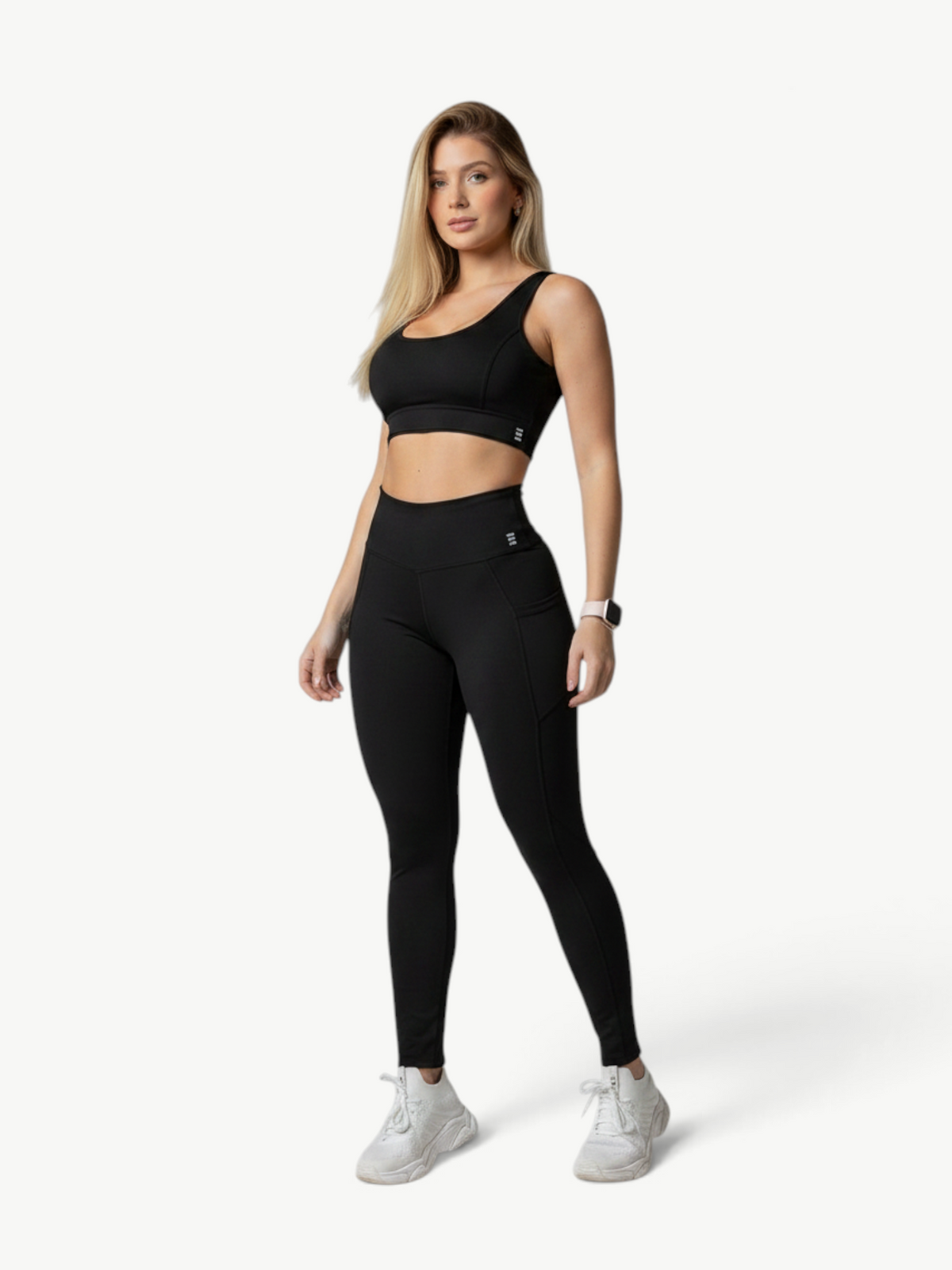 Model wearing a black JM Brazilian Activewear Polianna legging set with a supportive crop top and high-waisted leggings