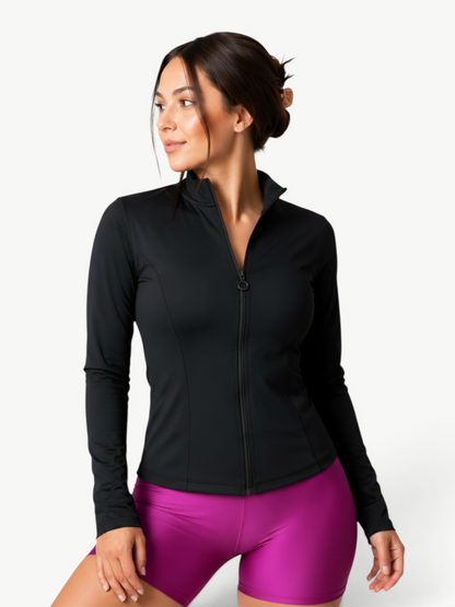Woman wearing a black JM Brazilian Activewear lightweight zip-up jacket with a high collar and long sleeves.