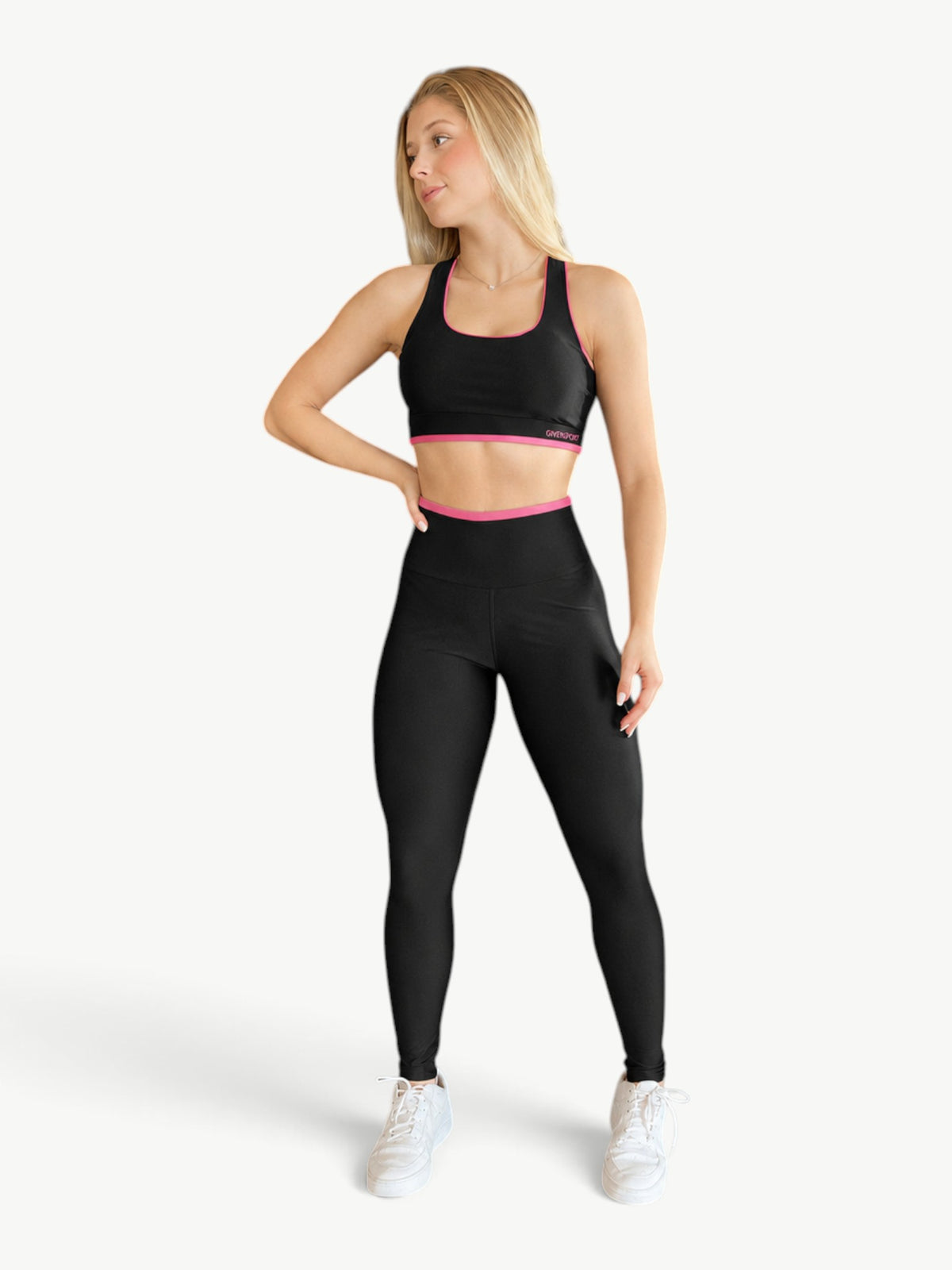 JM Brazilian Activewear black and pink contrast legging set with a cropped top and high-rise leggings on a model.