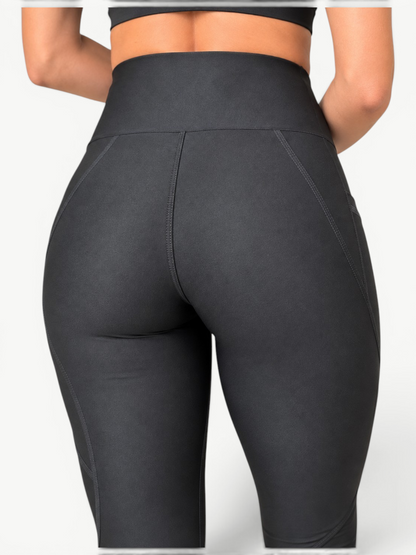 Rear view of JM Brazilian Activewear Polianna Sculpt high-rise black leggings with contour seams and side pockets