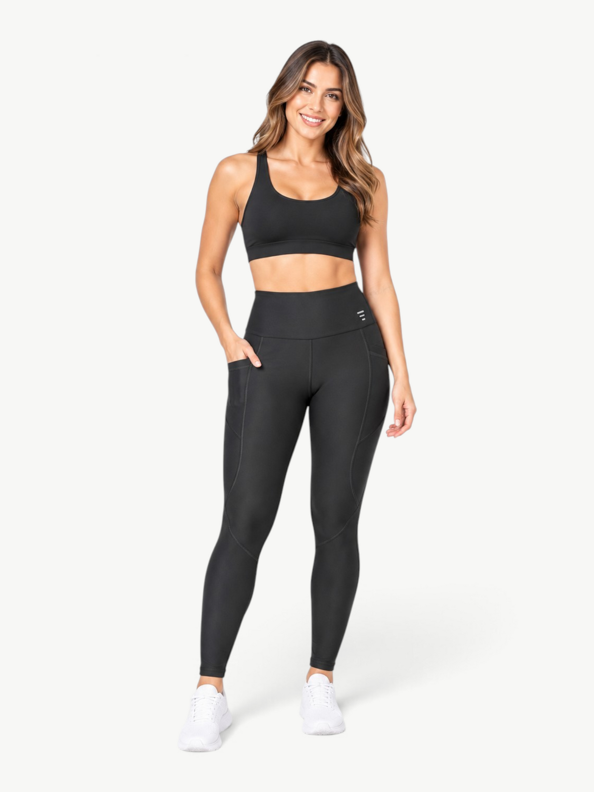 Model wearing JM Brazilian Activewear black high-rise Polianna Sculpt pocket leggings with contour seams.