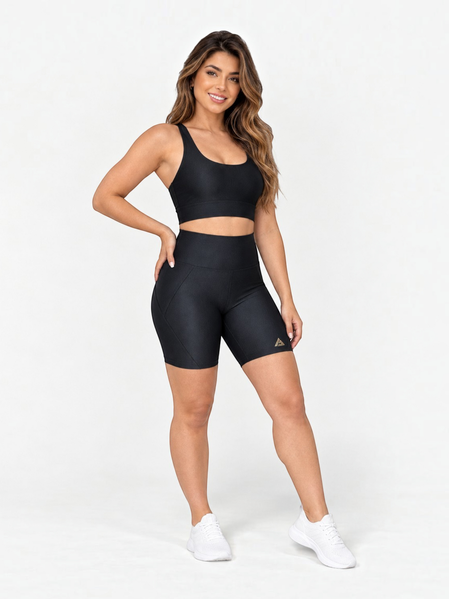 JM Brazilian Activewear black two-piece matching set with a supportive crop top and high-waisted biker shorts.