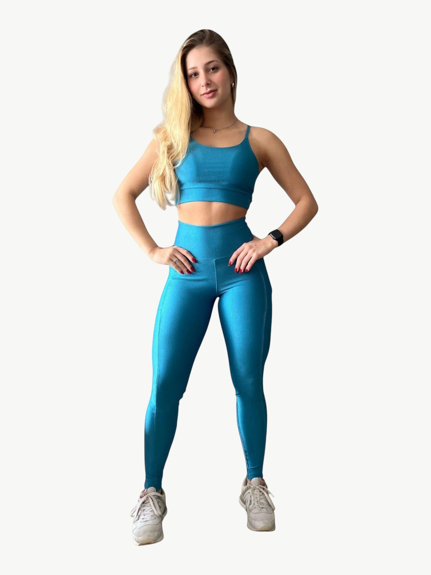 A woman wearing a JM Brazilian Activewear blue ribbed two-piece set with a sports bra and high-waisted leggings.