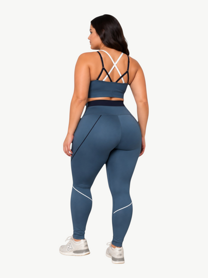 Model wearing JM Brazilian Activewear blue sculpting sports bra and high-waisted leggings, back view.