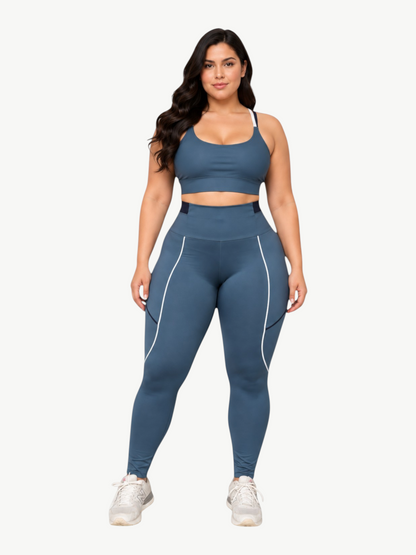 Model wearing JM Brazilian Activewear blue sculpting sports bra and high-waisted leggings with white piping detail