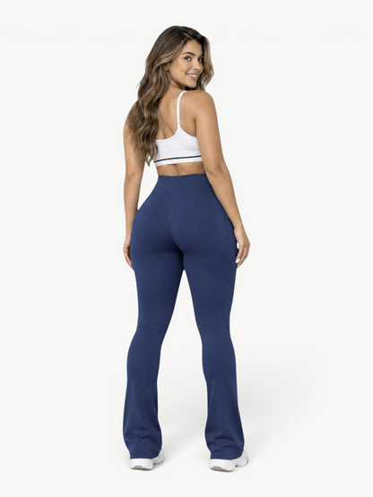Woman wearing JM Brazilian Activewear blue sculpting leggings with a high-stretch fit, viewed from the back.