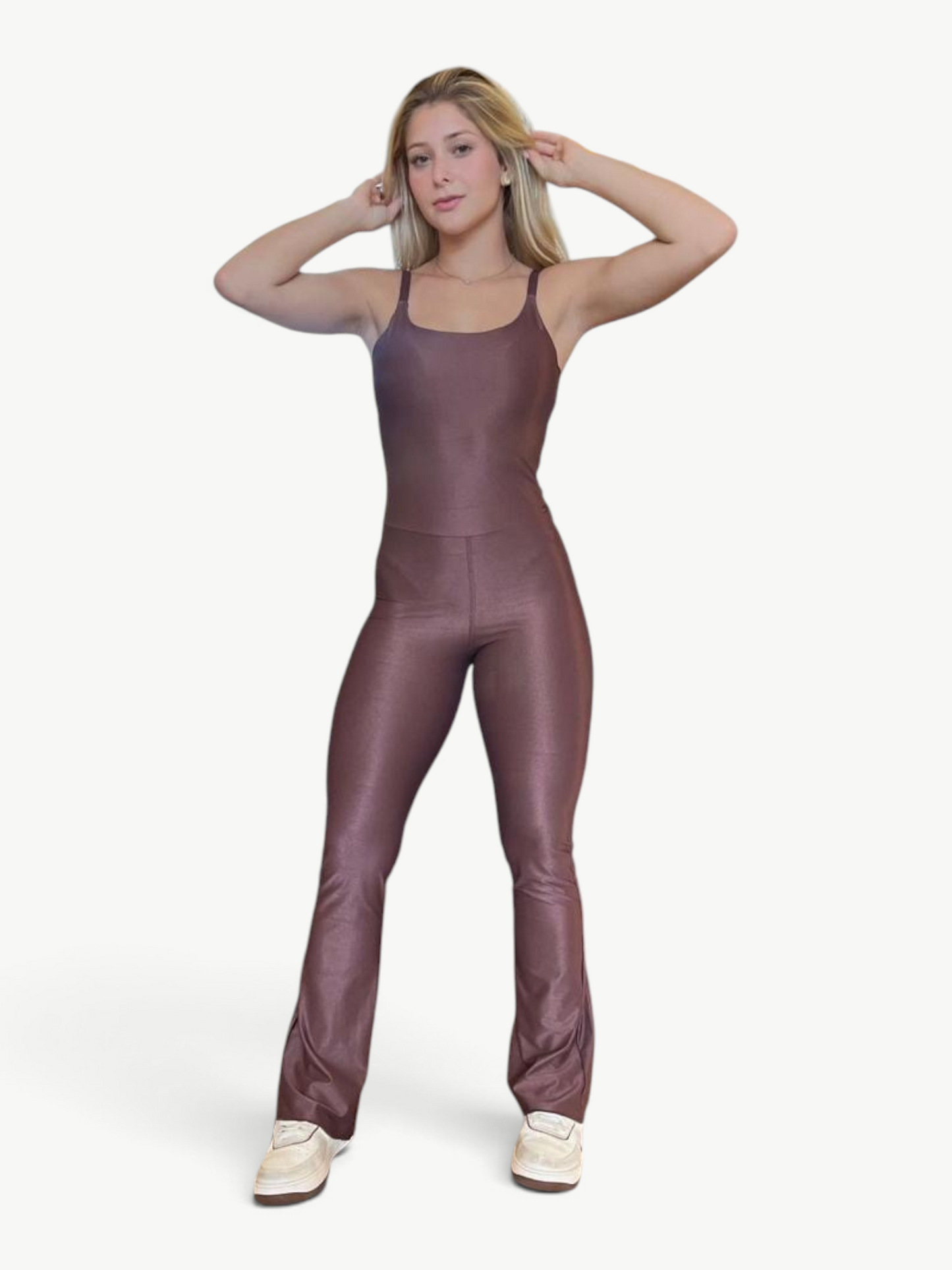 Woman wearing a JM Brazilian Activewear brown flare jumpsuit with a scoop neck and fitted silhouette