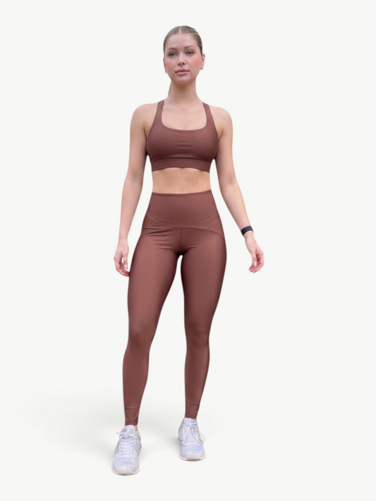 Model wearing a brown JM Brazilian Activewear Sunny Legging Set with a strappy-back sports bra and high-waisted leggings