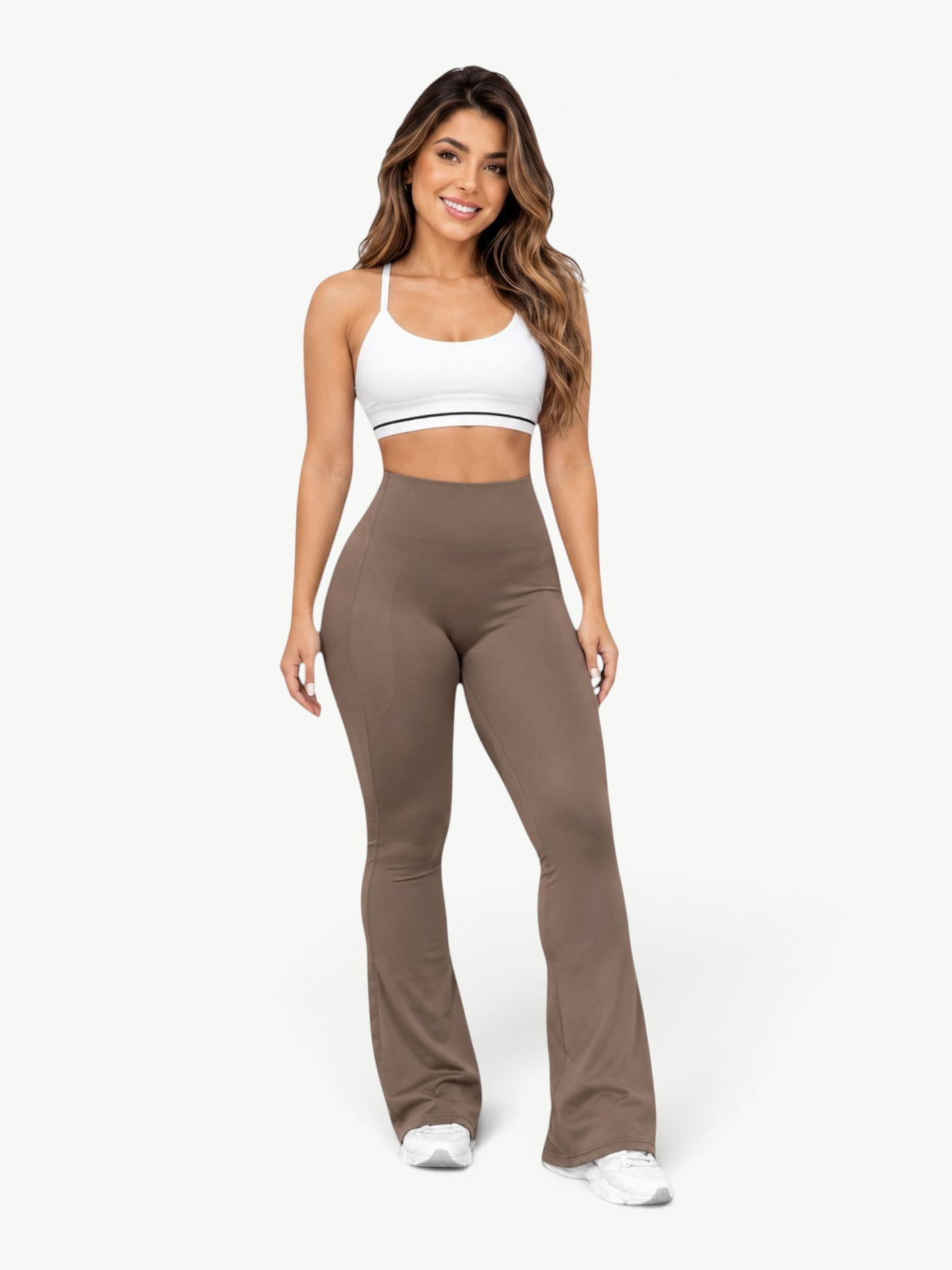 Model wearing JM Brazilian Activewear brown sculpting leggings with a white sports bra for a flattering fit.