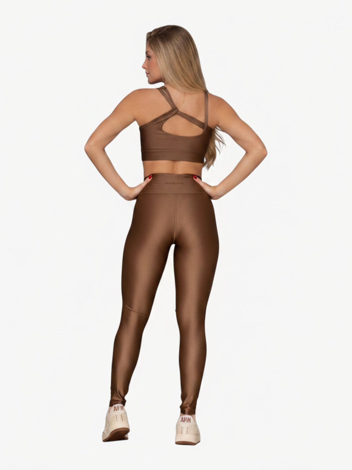 JM Brazilian Activewear brown sculpting two-piece set with a crossback top and high-waisted leggings on a model