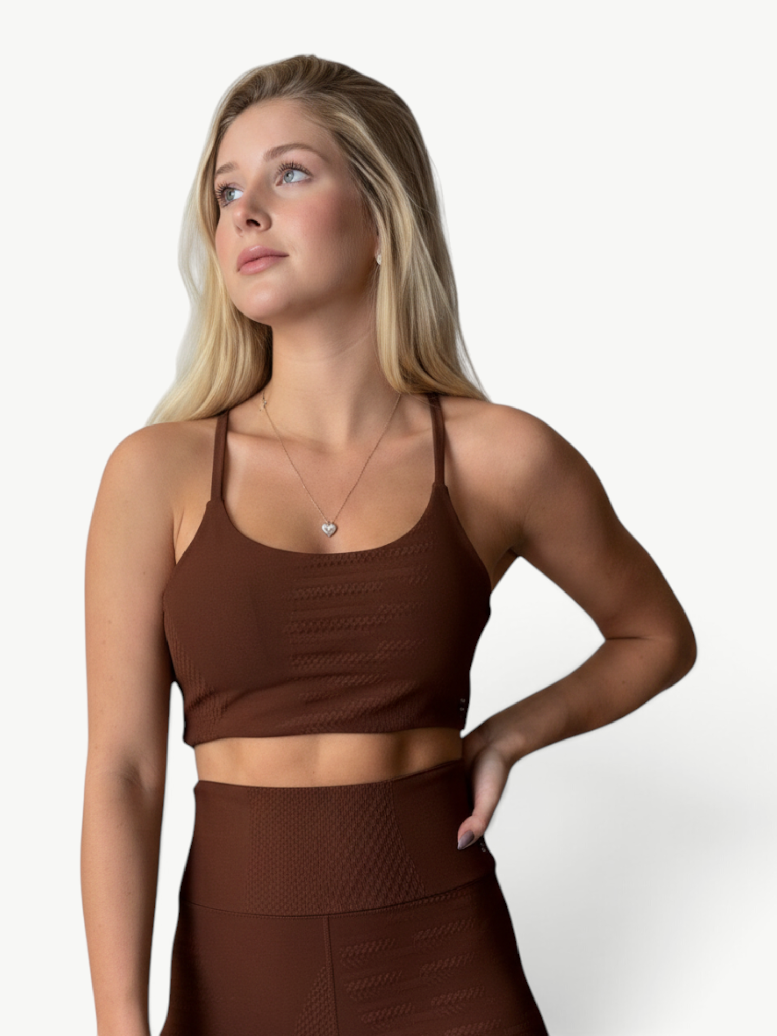 Model wearing a brown JM Brazilian Activewear textured crop top and high-waisted leggings set for workouts.