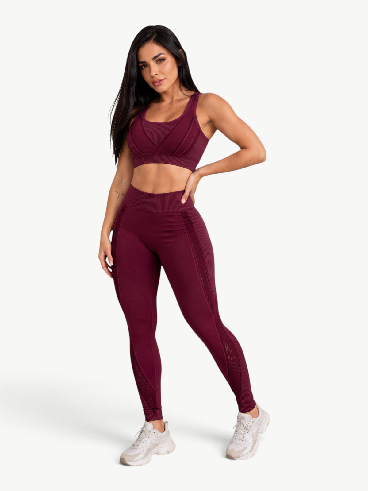 Model wearing a JM Brazilian Activewear burgundy sculpting legging set with a supportive sports bra and high waist.