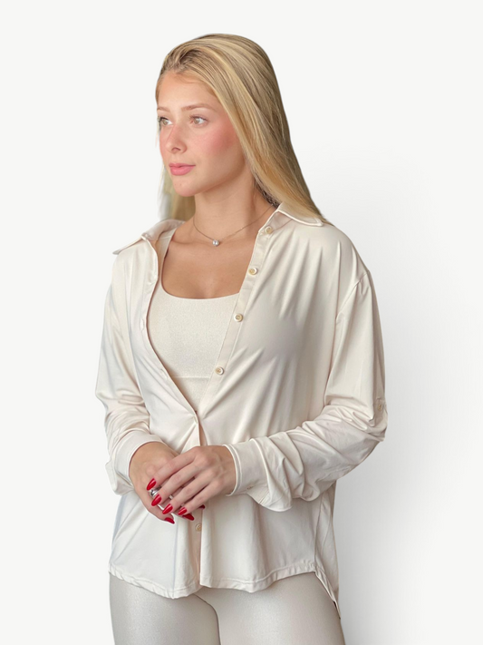 JM Brazilian Activewear long sleeve button-up top in cream, worn over a matching tank top for a versatile layered look.