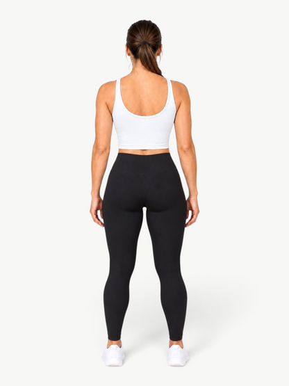JM Brazilian Activewear Dallas white cropped tank top worn with black leggings, back view on a model.