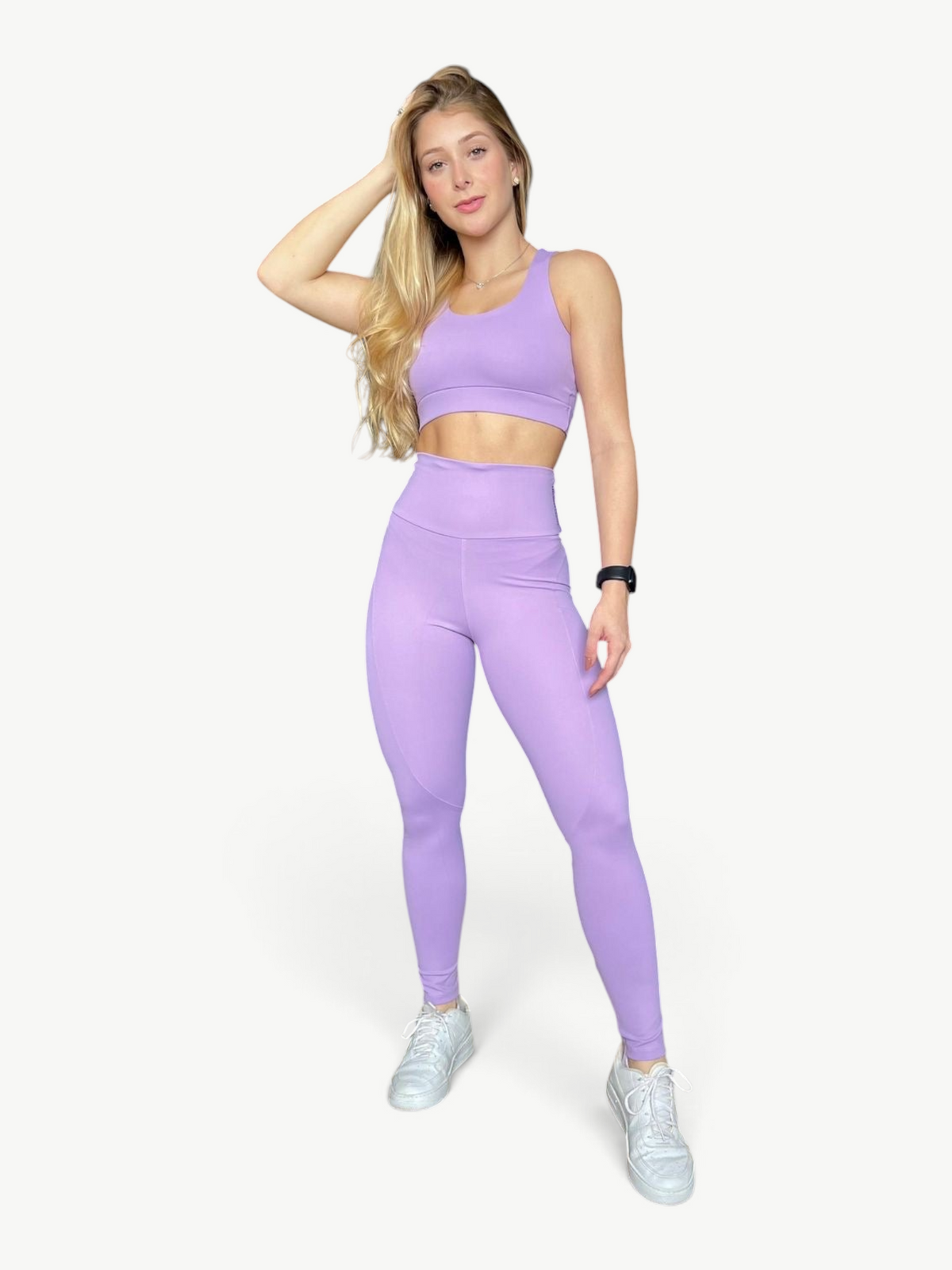 Model wearing a JM Brazilian Activewear lavender two-piece Soul Legging Set with a supportive top and high-waisted leggings