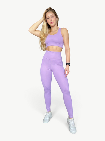 Model wearing a JM Brazilian Activewear lavender two-piece Soul Legging Set with a supportive top and high-waisted leggings