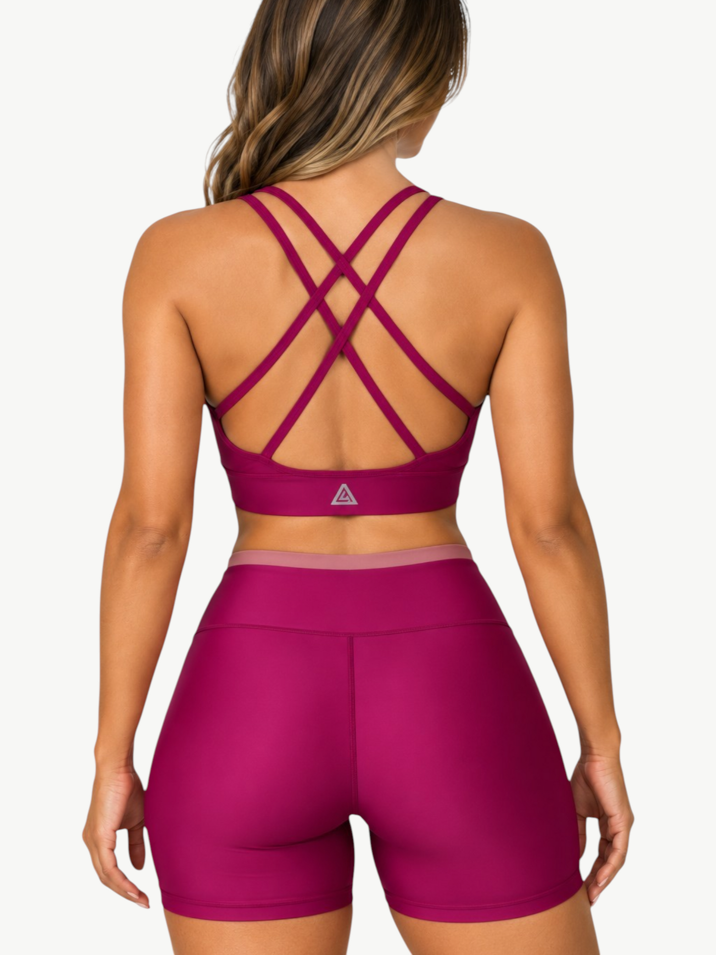 JM Brazilian Activewear Aurora Short Set in magenta with a supportive crisscross back crop top and high-waisted shorts