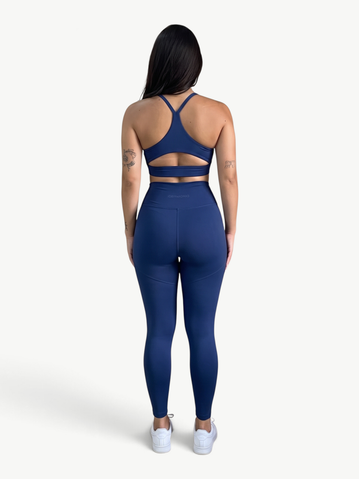 JM Brazilian Activewear navy blue two-piece matching set with a racerback sports bra and high-waisted leggings.