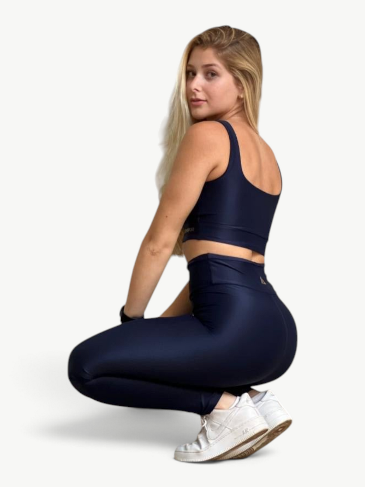 JM Brazilian Activewear navy blue two-piece set with a supportive crop top and high-waisted leggings on a model