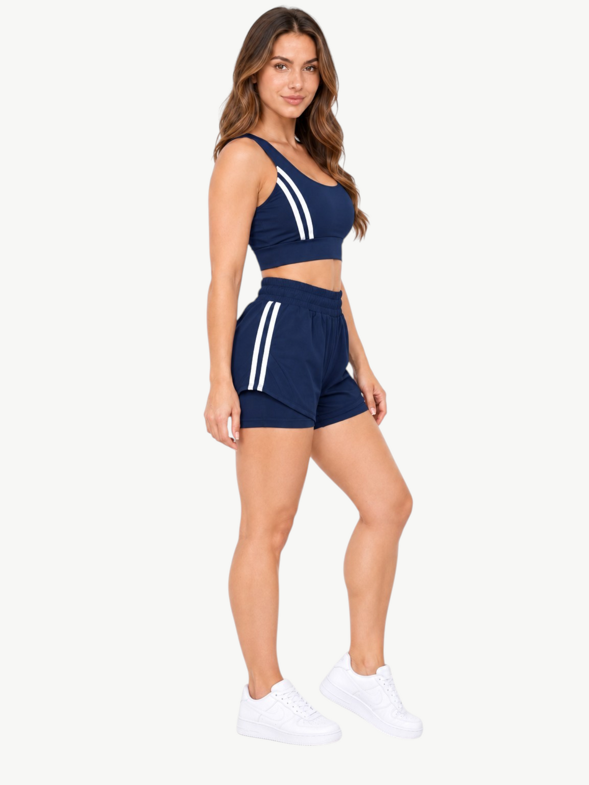 JM Brazilian Activewear navy blue 2-in-1 short set with white side stripes, crop top, and layered athletic shorts.