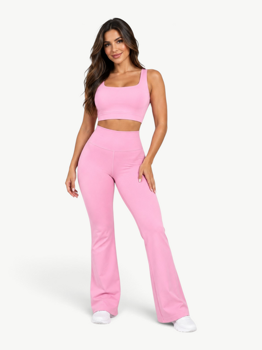Model wearing a pink JM Brazilian Activewear Contour Flare Set with a cropped top and high-waisted flare leggings.