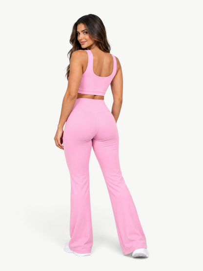 Model wearing a pink JM Brazilian Activewear Contour Flare Set with a cropped top and high-waisted flare leggings.