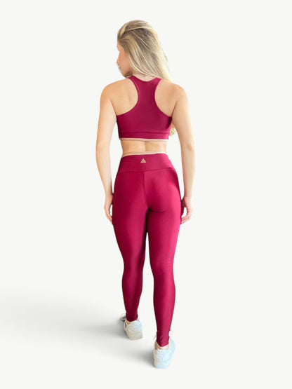 Model wearing JM Brazilian Activewear Speed Contrast Legging Set in deep red with a racerback crop top and leggings.