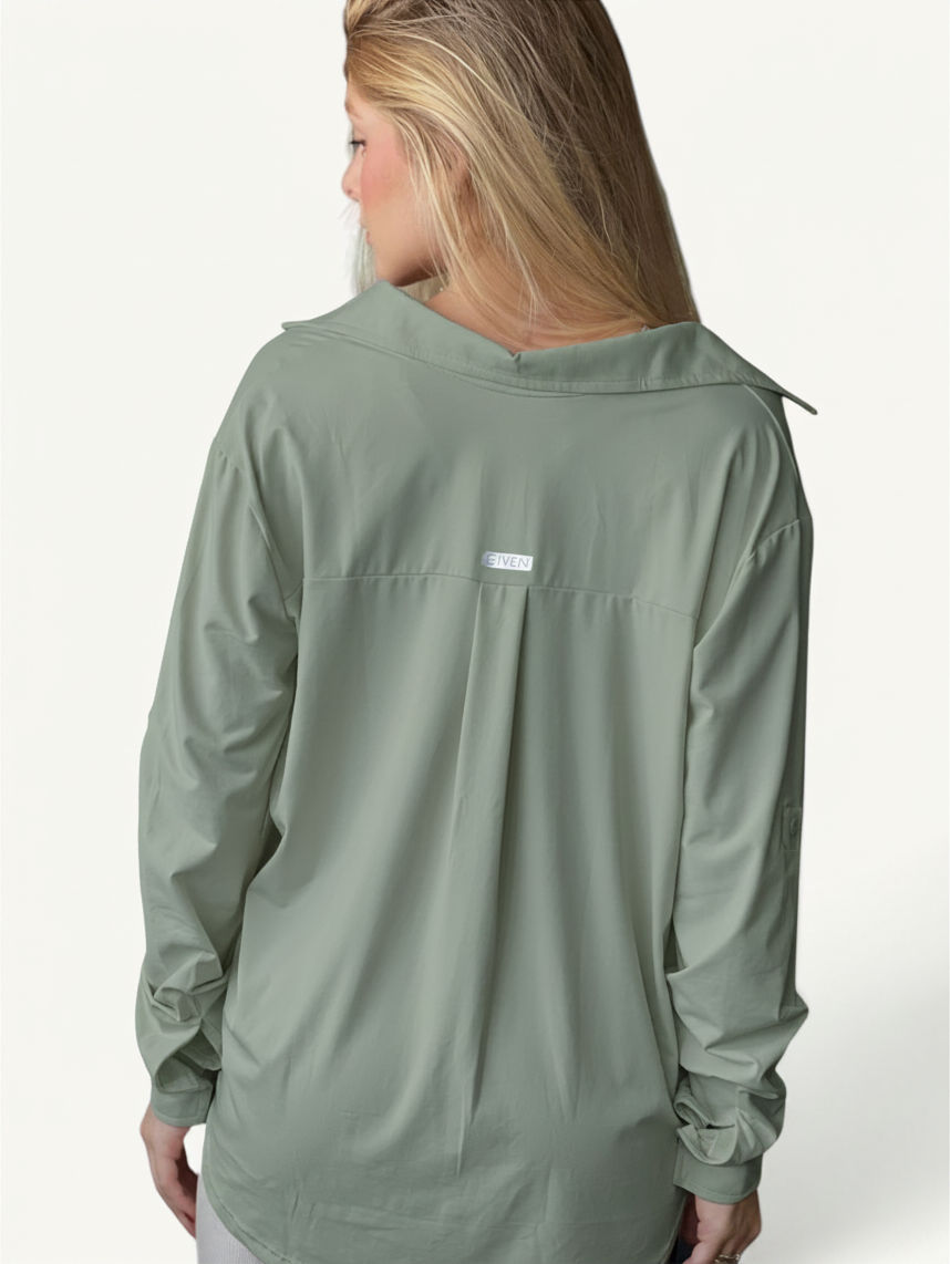 JM Brazilian Activewear sage green long sleeve button-up top with back yoke detail on a blonde model