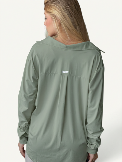 JM Brazilian Activewear sage green long sleeve button-up top with back yoke detail on a blonde model