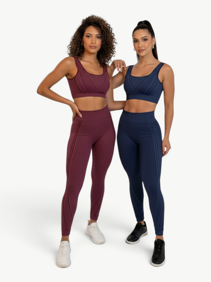 Two models wearing JM Brazilian Activewear Sculpt Legging Sets in burgundy and navy blue with contouring details.