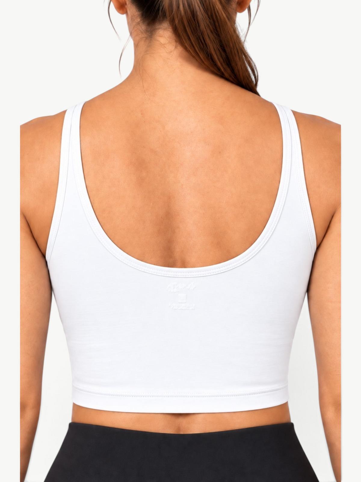 Back view of JM Brazilian Activewear Dallas white crop top with a scoop neckline and soft stretch fabric