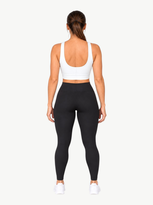 JM Brazilian Activewear white Poliana scoop back top with wide straps and supportive band, worn by a model from behind.
